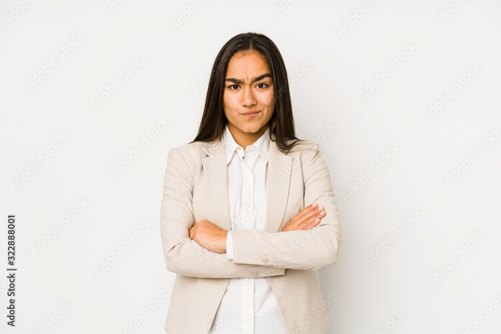 Young woman isolated on a white background frowning face in displeasure, keeps arms folded. Young woman isolated on a white background frowning face in displeasure, keeps arms folded.