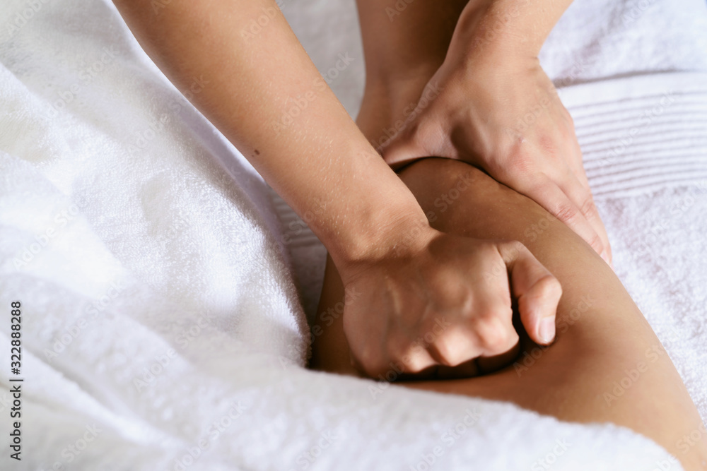 Close up of anti cellulite massage for young woman in wellness center. Perfect skin fat burning beauty concept Close up of anti cellulite massage for young woman in wellness center. Perfect skin fat burning beauty concept