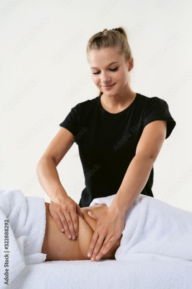 Anti cellulite massage fat female belly after pregnancy therapy in beauty salon. Perfect skin fat burning beauty concept. Masseur ay work in wellness center Anti cellulite massage fat female belly after pregnancy therapy in beauty salon. Perfect skin fat burning beauty concept. Masseur ay work in wellness center