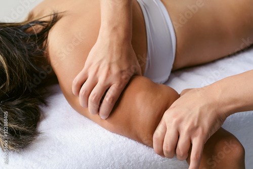 Fat burning anti cellulite massage for young woman in wellness center. Perfect skin fat burning weight loss beauty concept