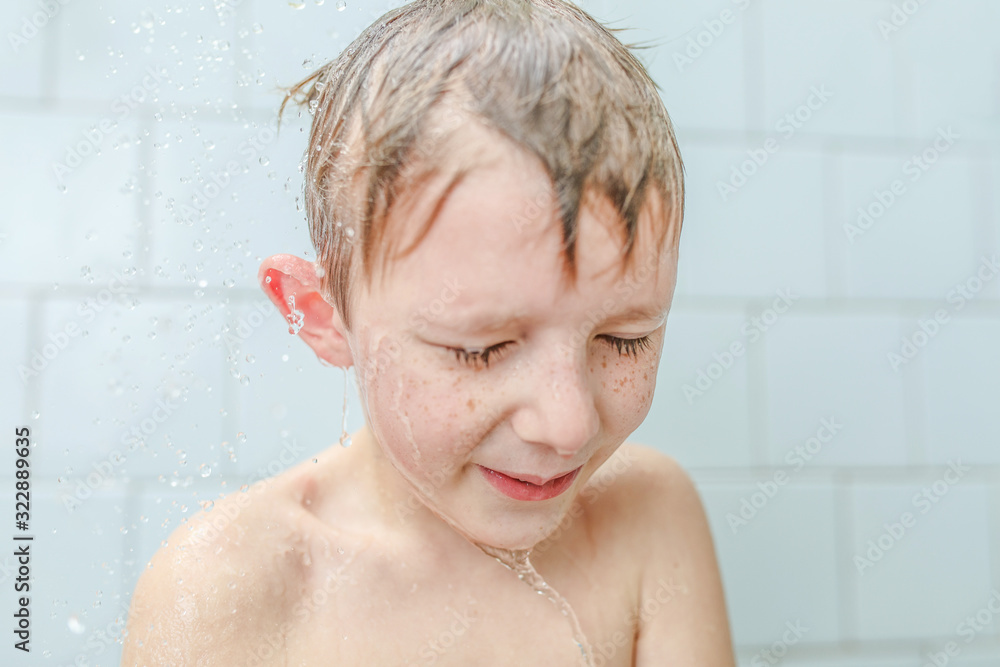 little boy washe in the shower shampoo on his face little boy washe in the shower shampoo on his face