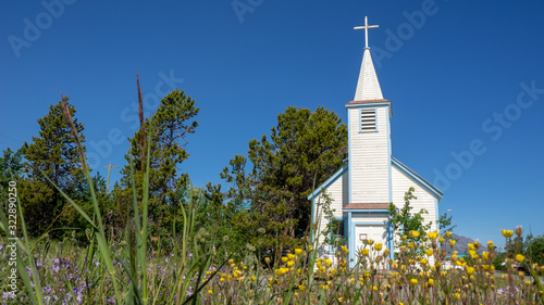 Small church with steeple in small village