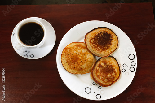 Coffee and Arepuelas made with wheat flour, breakfast on the table, Bogotá Colombia, February 13, 2020
