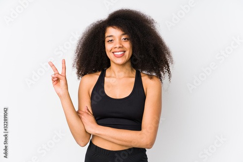 Young african american sporty woman showing number two with fingers.