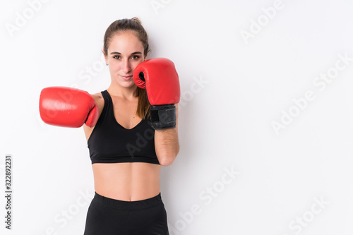 Young caucasian sporty woman boxing © Asier