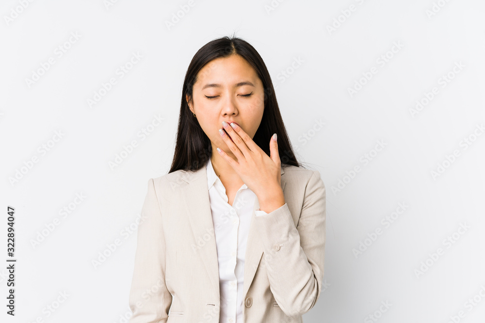 Young chinese business woman isolated yawning showing a tired gesture covering mouth with hand. Young chinese business woman isolated yawning showing a tired gesture covering mouth with hand.