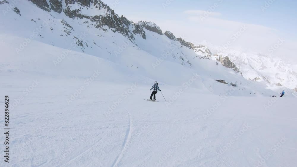 Woman skiing carefully on high mountains in Ponte di Legno. Woman skiing carefully on high mountains in Ponte di Legno.
