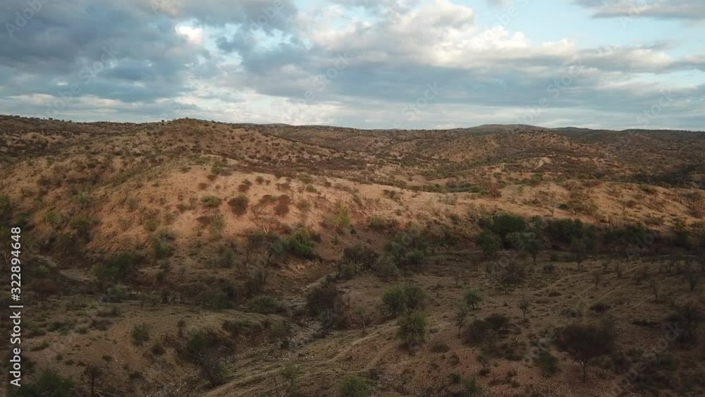 4K aerial drone summer day video African savanna and dry riverbeds surrounded by bush covered hills in Daan Viljoen National Game Park in Khomas Hochland area near Windhoek, Namibia's capital, Africa 4K aerial drone summer day video African savanna and dry riverbeds surrounded by bush covered hills in Daan Viljoen National Game Park in Khomas Hochland area near Windhoek, Namibia's capital, Africa