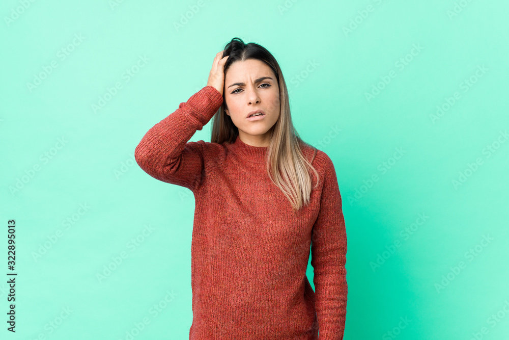 Young caucasian woman isolated tired and very sleepy keeping hand on head. Young caucasian woman isolated tired and very sleepy keeping hand on head.
