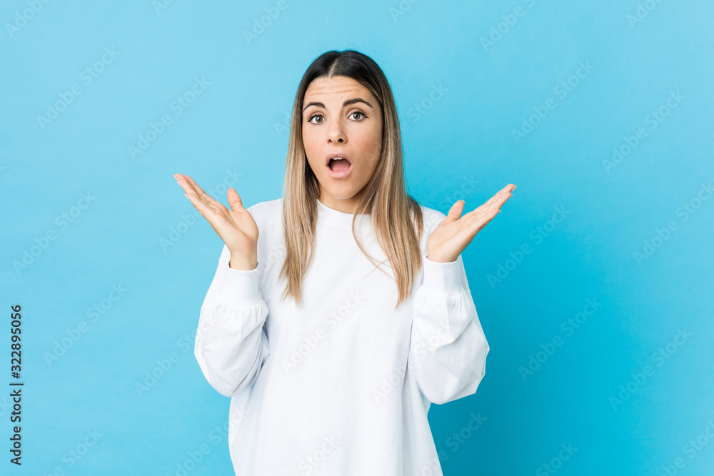 Young caucasian woman isolated surprised and shocked. Young caucasian woman isolated surprised and shocked.