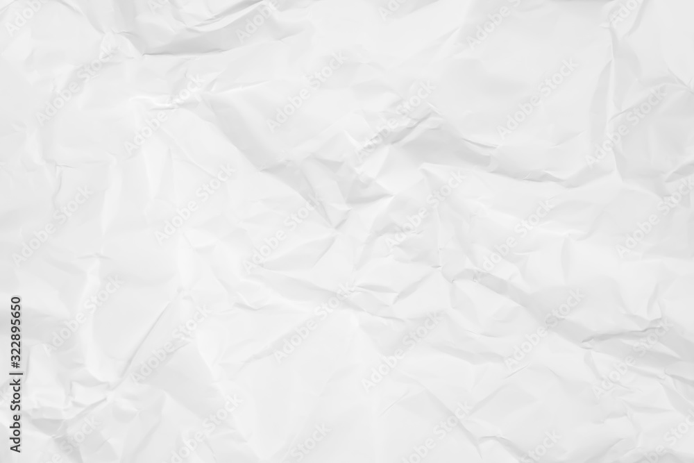 White crumpled paper texture background. Clean white paper. Top view. White crumpled paper texture background. Clean white paper. Top view.