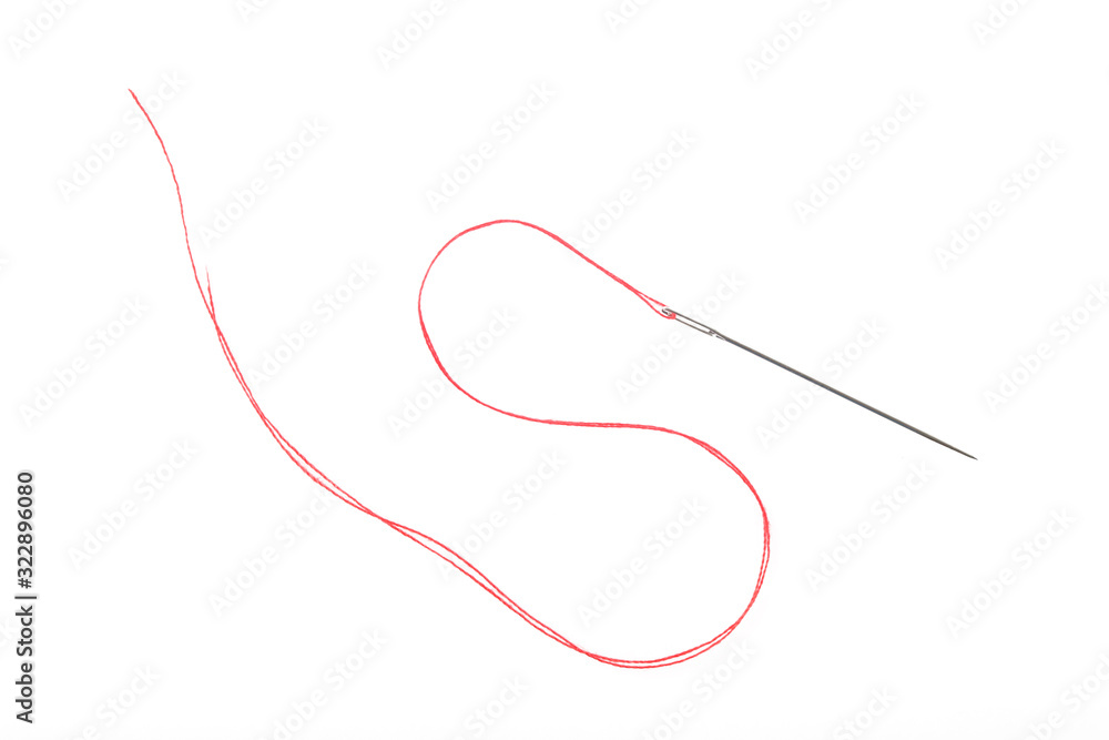 Sewing needle with red thread on the white background Sewing needle with red thread on the white background