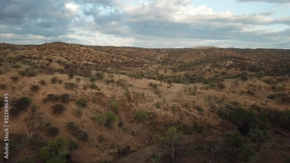 4K aerial drone summer day video African savanna and dry riverbeds surrounded by bush covered hills in Daan Viljoen National Game Park in Khomas Hochland area near Windhoek, Namibia's capital, Africa 4K aerial drone summer day video African savanna and dry riverbeds surrounded by bush covered hills in Daan Viljoen National Game Park in Khomas Hochland area near Windhoek, Namibia's capital, Africa