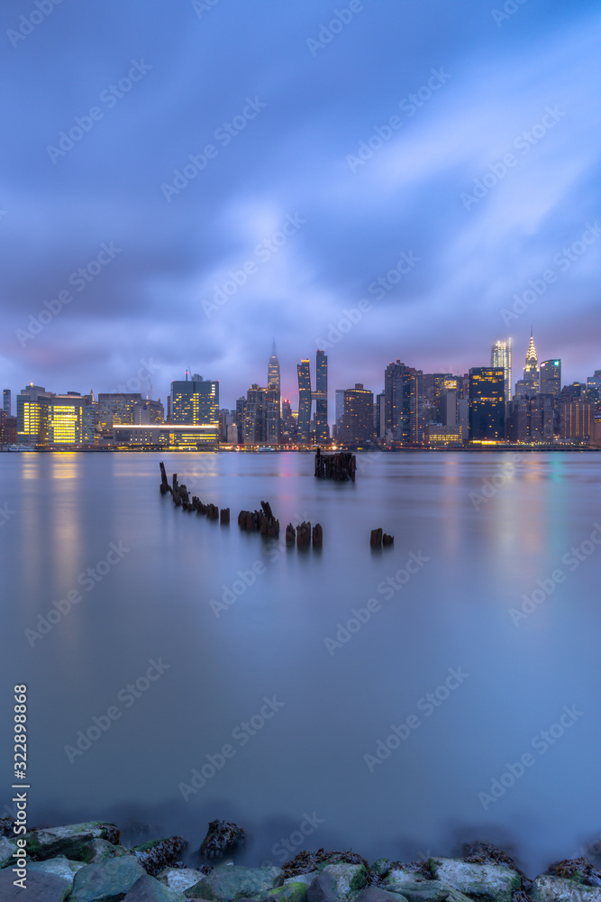 View on Midtown Manhattan from East River at sunrise with long exposure