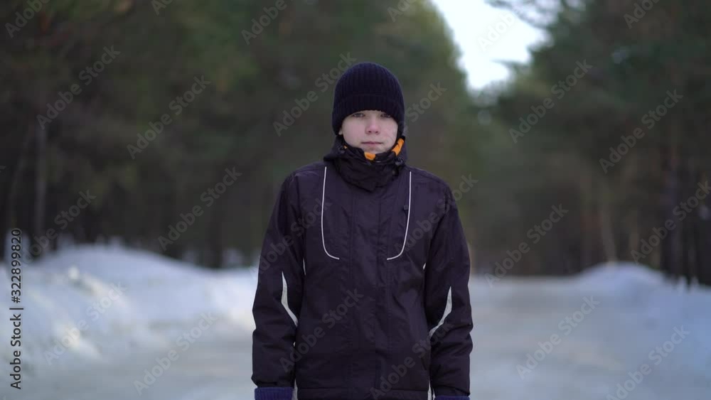 Portrait of Handsome Young Male Athlete Jogging in Winter Woods Portrait of Handsome Young Male Athlete Jogging in Winter Woods