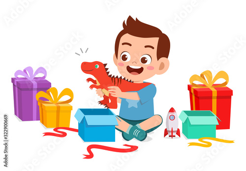 happy cute little kid boy open gift from birthday