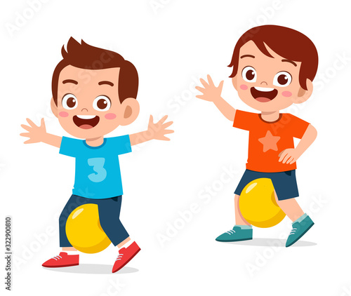happy cute little kid boy exercise with ball