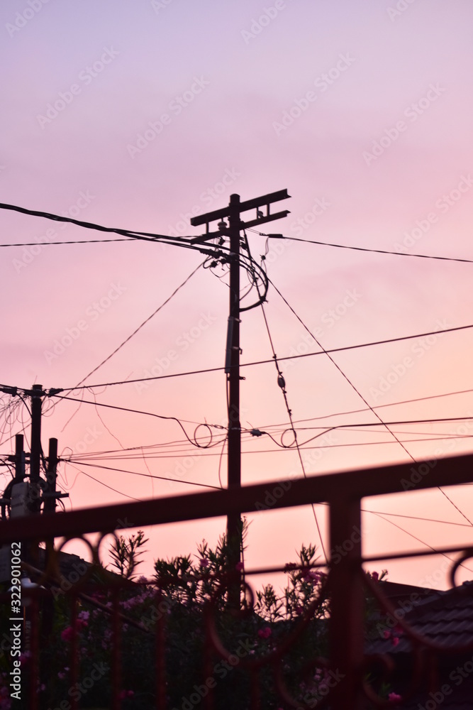 power lines and electricity pylons at sunset