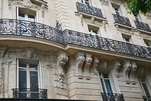Paris, typical old apartment building with ornate baroque stonework
