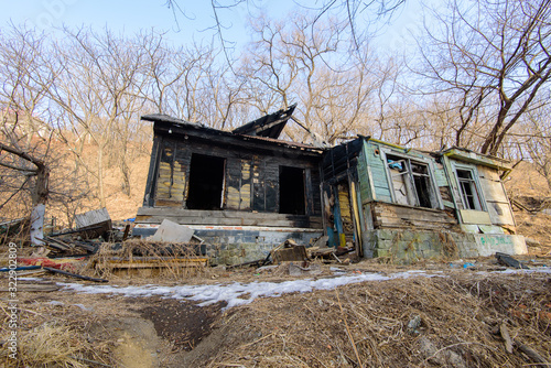 The burned-down abandoned barrack.