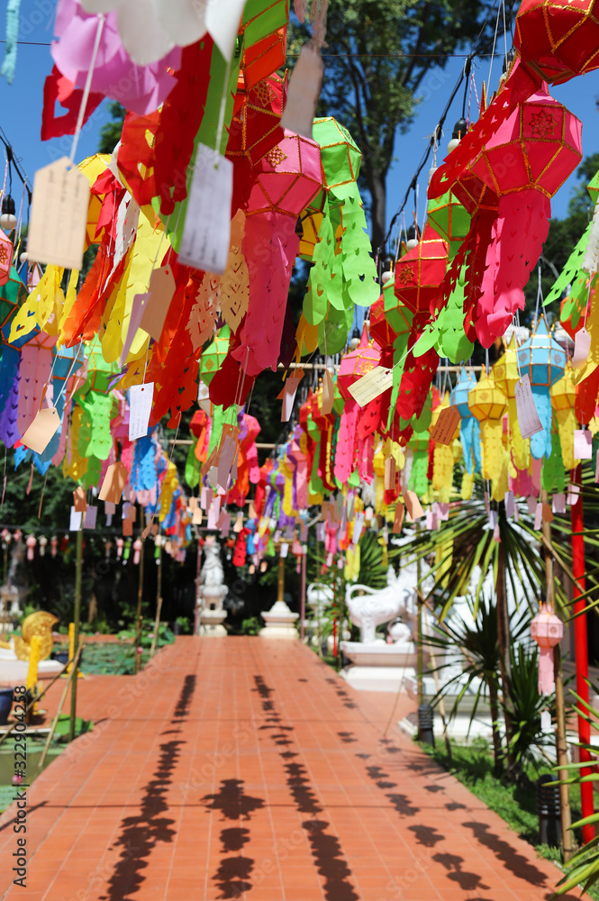 Fototapeta premium Scenery of colorful handmade paper lantern hanging in front of the temple. Vertical view. 