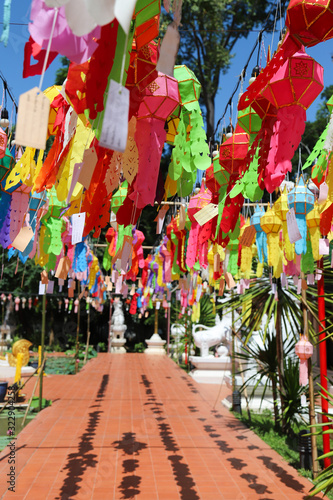 Scenery of colorful handmade paper lantern hanging in front of the temple. Vertical view. 