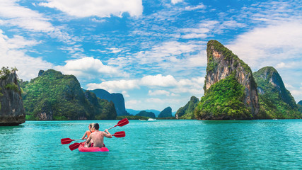 Beautiful nature scenic landscape island with activity couple traveler kayaking Phang-Nga bay, Tourist adventure travel Phuket Thailand, Tourism destination place Asia, Summer holiday vacation trip