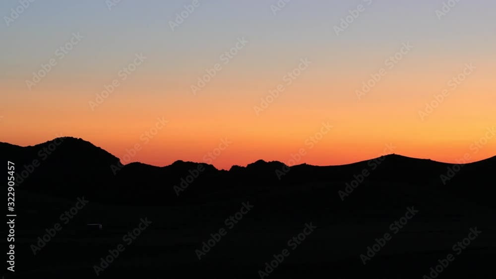 silhouette mountain and beautiful sunrise in Monglia silhouette mountain and beautiful sunrise in Monglia