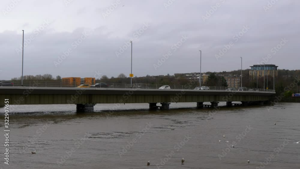 Cars Passing over Greyhound Bridge Lancaster in Lancashire at Extreme High Tide River about to Burst its Banks following Storm Ciara Wide Shot Tripod Cars Passing over Greyhound Bridge Lancaster in Lancashire at Extreme High Tide River about to Burst its Banks following Storm Ciara Wide Shot Tripod
