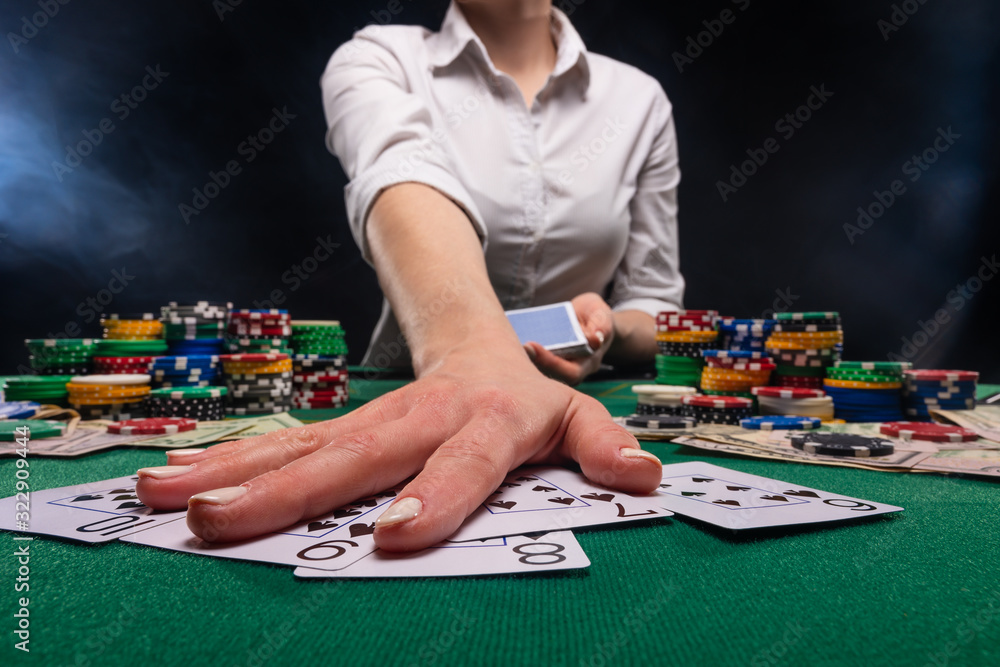 The croupier at the gaming table in the casino. The croupier at the gaming table in the casino.