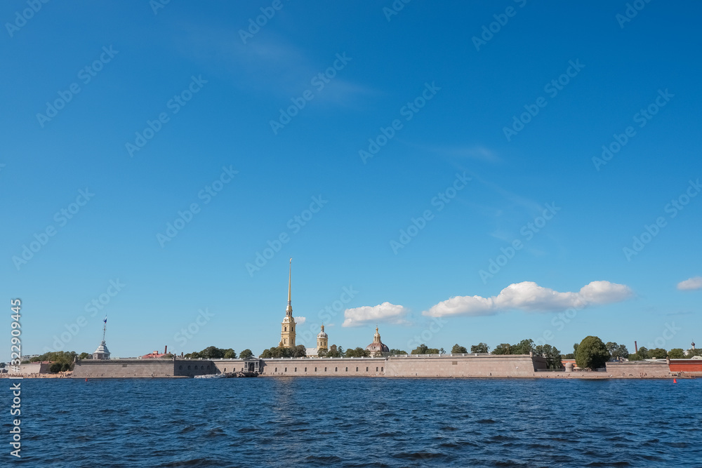 St. Petersburg, Neva, Peter and Paul fortress, Russia. Summer urban landscape of the Northern capital of Russia.Beautiful view on a Sunny day, the Neva river and beautiful blue sky. Copyspace. Travel
