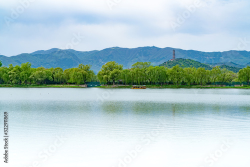 Kunming Lake in Summer Palace, Beijing, China. Distant view of the tower of Yuquan Mountain photo