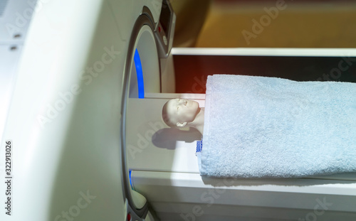 model patient undergoing CT scan in hospital
