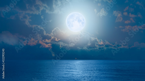 Night sky with moon in the clouds  Elements of this image furnished by NASA