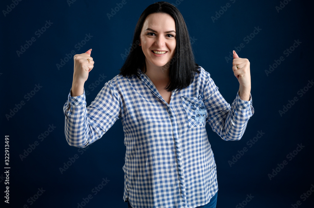 Young woman dressed casually smiling joyfully and looking happy Young woman dressed casually smiling joyfully and looking happy
