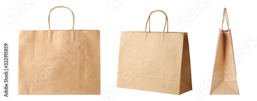 Brown paper shopping bags isolated on white background photo