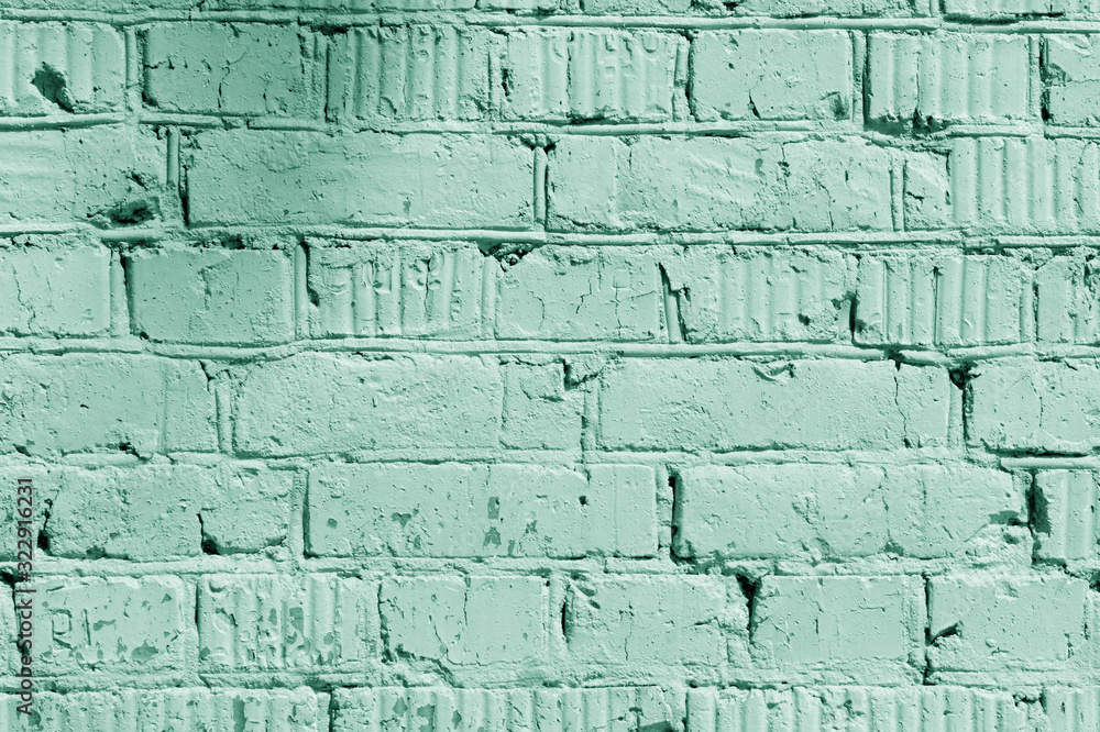 Fototapeta premium Painted brick wall close up. Abstract background green color toned