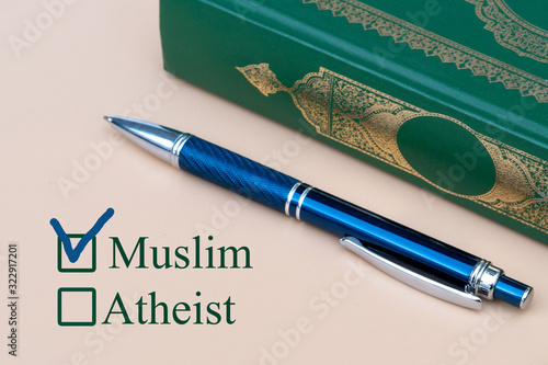 Photography On a piece of paper are written Muslim and Atheist with a choice