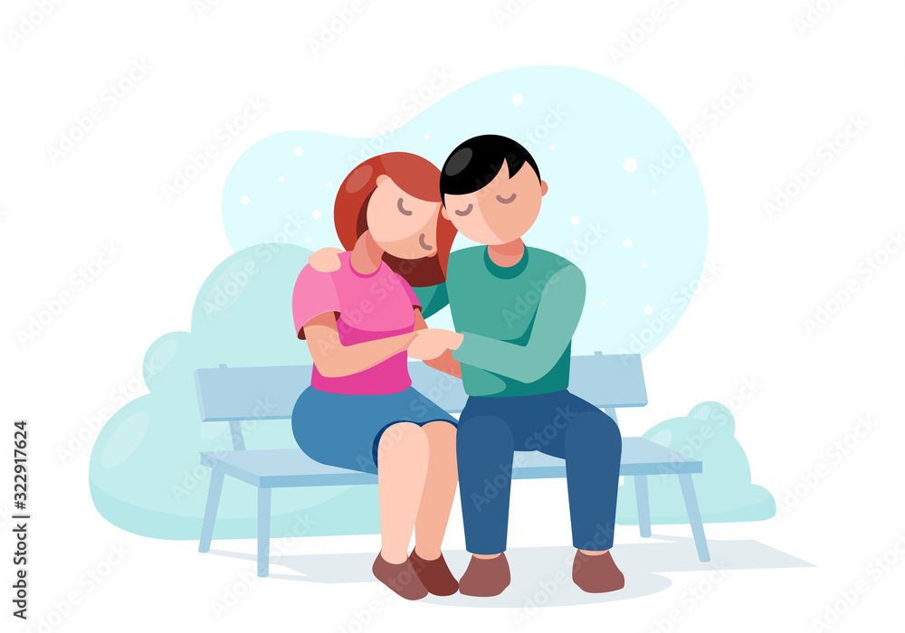 Couple in love on a date sitting on a park bench Couple in love on a date sitting on a park bench