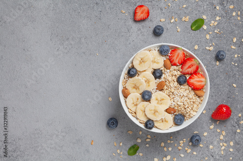 Homemade oatmeal granola with strawberries, blueberry and banana. Healthy breakfast