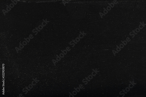 black blackboard or chalkboard grain abstract texture background