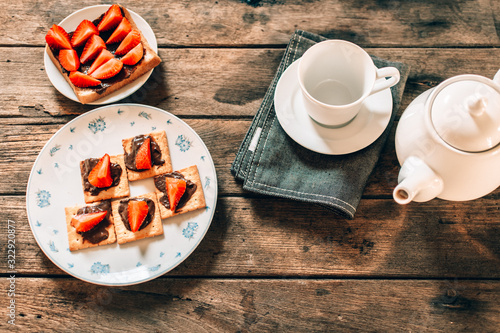 Breakfast sets were placed on a wooden table.