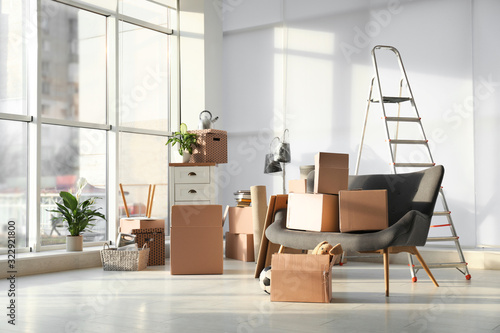 Wallpaper Mural Cardboard boxes and household stuff in living room. Moving day Torontodigital.ca