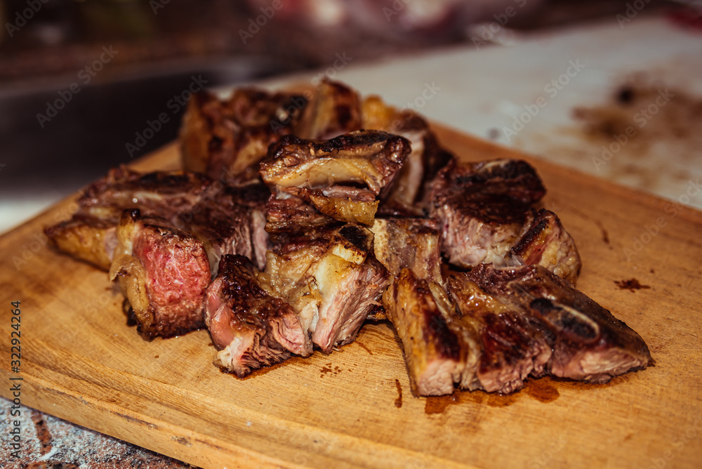 Roasted sliced barbecue meat ribs, focus on sliced meat. Roasted sliced barbecue meat ribs, focus on sliced meat.