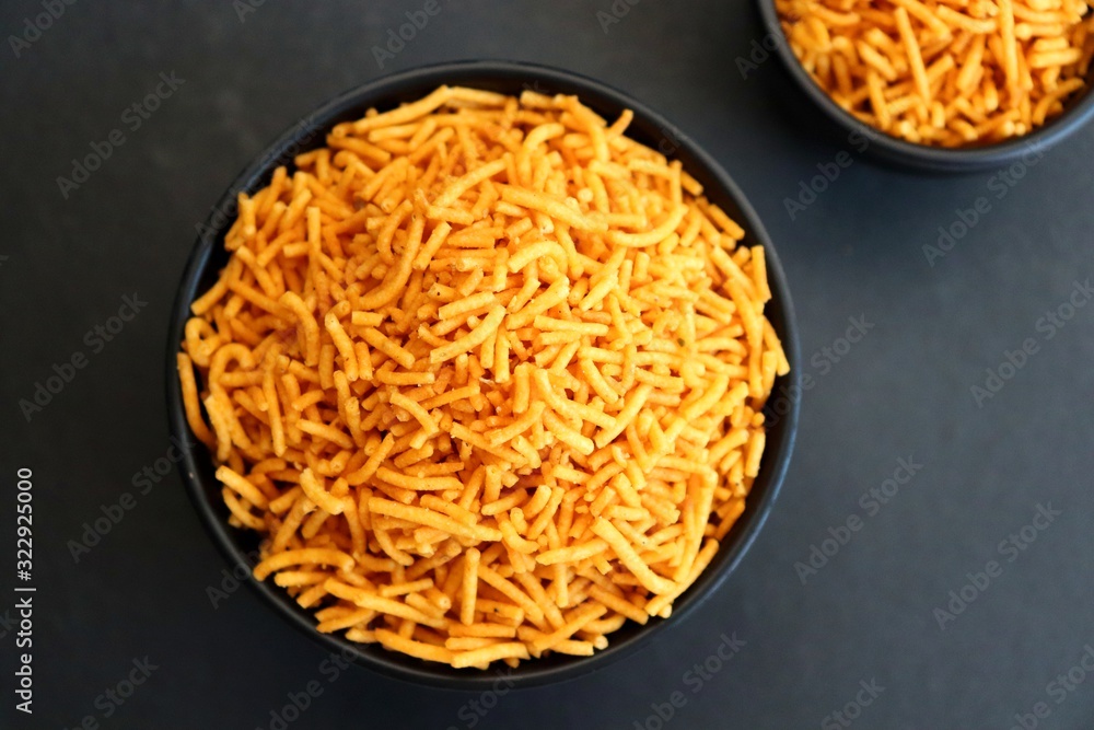 Aloo bhujia sev also known as Bikaneri Namkeen Sev is a popular crispy fried snack prepared by using Potatoes, Chickpea or Gram flour and spices. Its a best tea time snack. Copy space Aloo bhujia sev also known as Bikaneri Namkeen Sev is a popular crispy fried snack prepared by using Potatoes, Chickpea or Gram flour and spices. Its a best tea time snack. Copy space