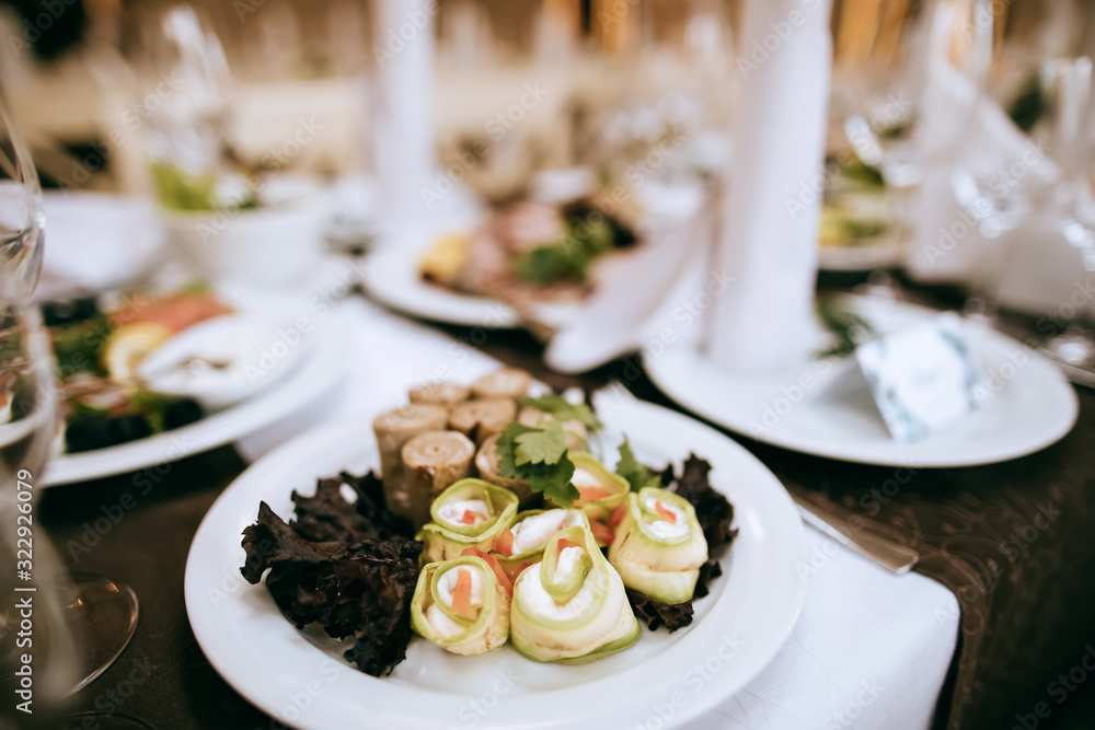 Food on the table for dinner at a restaurant at a wedding party. Table set Food on the table for dinner at a restaurant at a wedding party. Table set