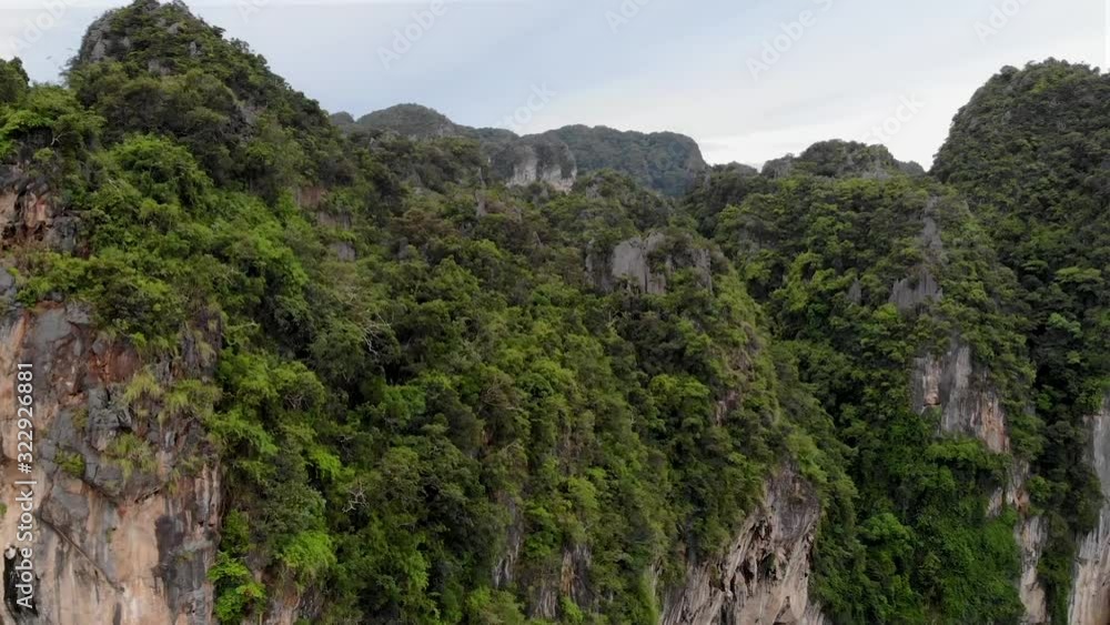 A descent down beautiful limestone cliffs in Railay, Ao Nang, Thailand - Shot from a DJI Mavic Air. A descent down beautiful limestone cliffs in Railay, Ao Nang, Thailand - Shot from a DJI Mavic Air.