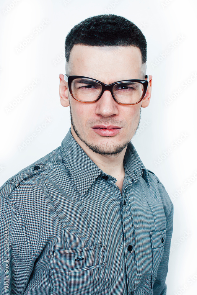 young handsome teenage hipster guy posing emotional wearing glasses, happy smiling lifestyle people concept young handsome teenage hipster guy posing emotional wearing glasses, happy smiling lifestyle people concept