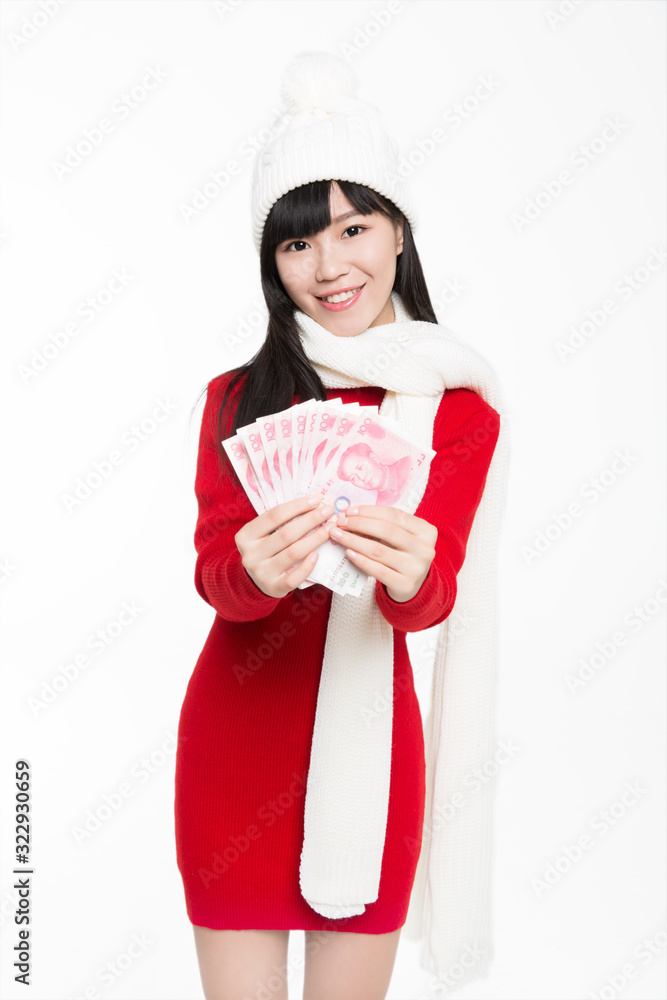 beautiful girl holding wad of money,smiling,white background,studio shot.