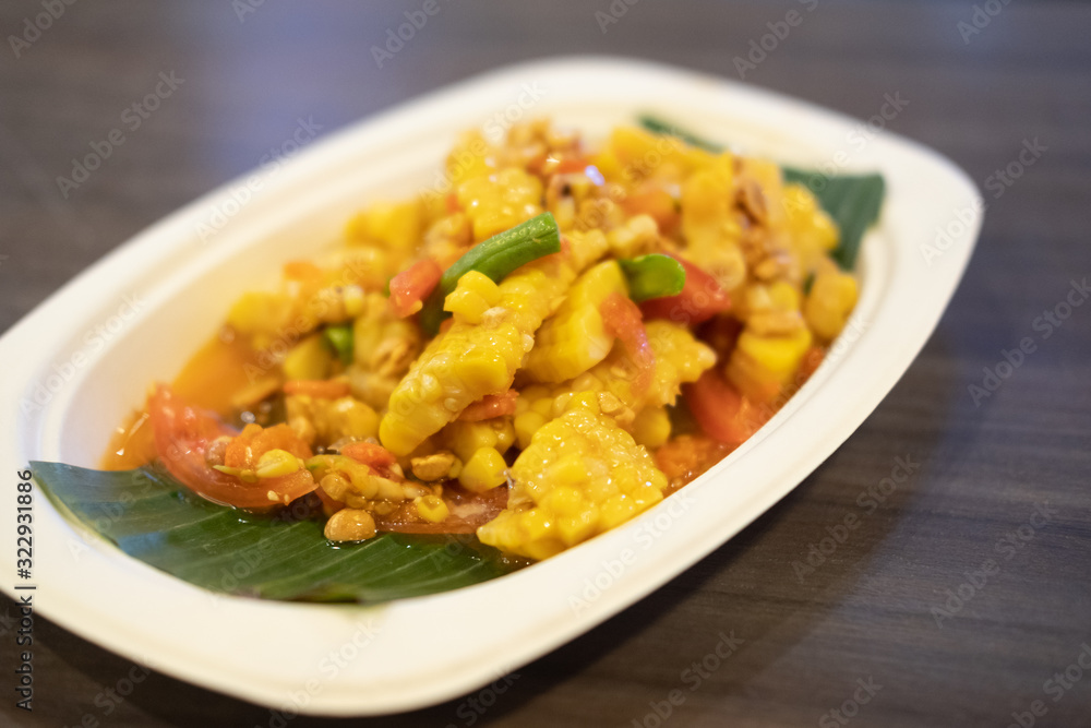 Spicy fruits salad mixed with corn and tomato Spicy fruits salad mixed with corn and tomato